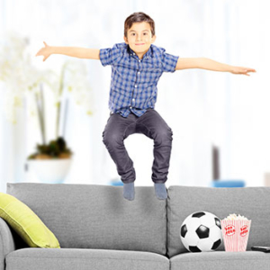 Child Jumping On Couch