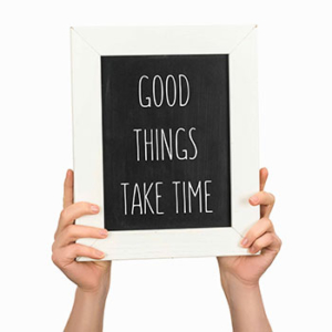 sign that says "Good things take time"