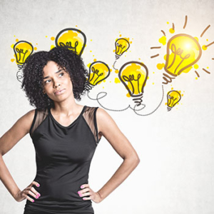 women with hands on hips looking perplexed with drawn yellow lightbulbs behind her
