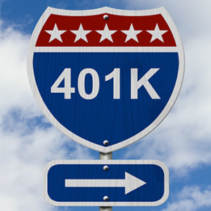 interstate road sign saying '401 K' with a right arrow sign below it and blue skies with clouds in the background